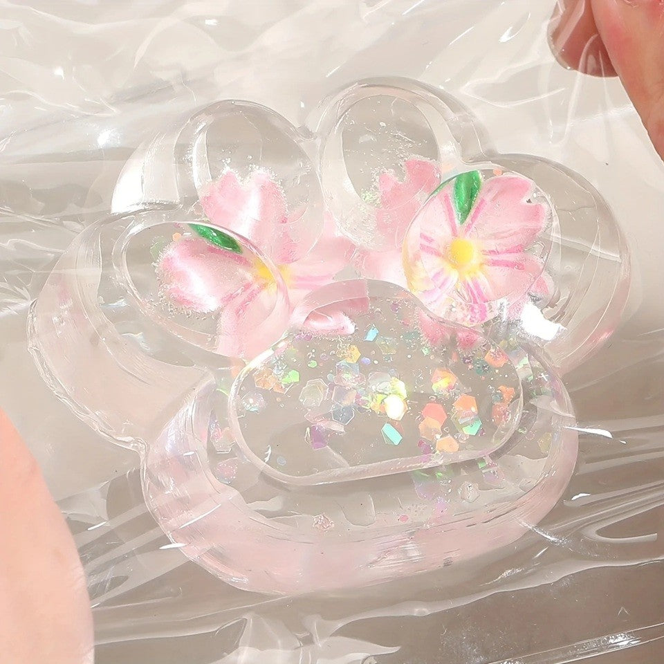 Jucarie Antistres Squishy, Vivimall, Labuta de Pisica Pufoasa, cu Revenire Lenta, 7 x 6.5 cm, Model Flori 2, Transparent - vivimall.ro