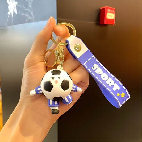 Breloc Flippy minge de fotbal cu căști, tematică Cupă Mondială, detaliu design acril albastru