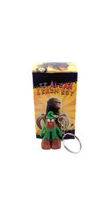 Figurină breloc silicon Brainrot Brr Brr Patapim de 4 cm, vedere laterală, culori verde și maro, brand Flippy