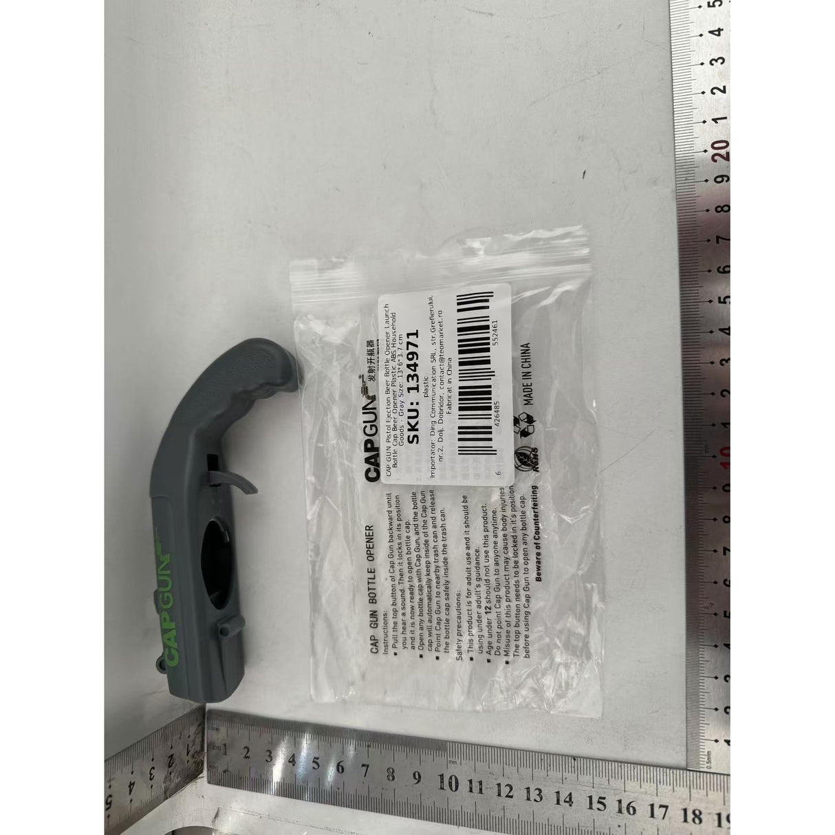 Deschizator de sticle, Vivimall, Model Pistol, Plastic, ABS, pentru Dopuri Metalice, 13 x 6 x 3.7 cm, Gri - vivimall.ro