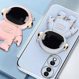 Detaliu suport tip astronaut husă Huawei Mate 60 Pro verde, poziție verticală pentru telefon