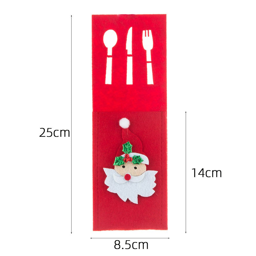Husă festiva tacâmuri roșie model Moș Crăciun așezată pe masă decorată de Crăciun