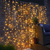 Instalatie Craciun, Tip Perdea, IP44, 9 m x 3 m, 720 LED-uri, Alb Cald, cu 8 jocuri de lumini, 31 V, 9W, Interconectabila, Prelungitor 3 m inclus, Fir transparent, Interior/ Exterior, Vivimall - vivimall.ro