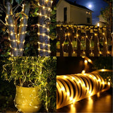 Instalație luminoasă de Crăciun solar aprinsă noaptea în exterior, efect alb cald, 100 LED-uri