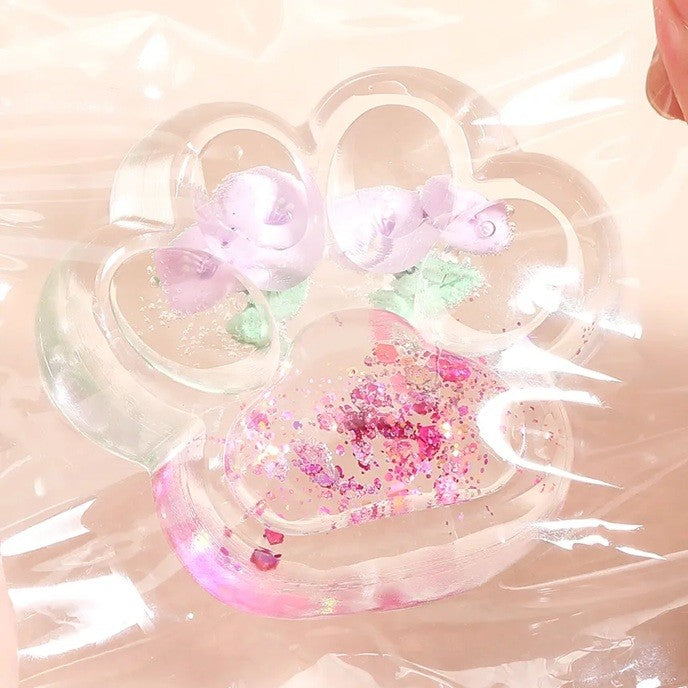 Jucarie Antistres Squishy, Flippy, Labuta de Pisica Pufoasa, cu Revenire Lenta, 7 x 6.5 cm, Model Flori 1, Transparent - vivimall.ro