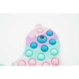 Jucarie senzoriala antistres, Simple Dimple, Delfin, Macarons,Flippy