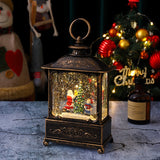 Felinar decorativ Moș Crăciun cu băiețel, model vintage negru-auriu, vedere frontală completă, 23 cm înălțime