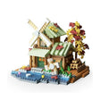 Set construcție Flippy Forest Log Cabin, 717 piese ABS, model căsuță cu moară de vânt, vedere frontală, multicolor