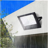 Proiector LED/Lampa solara de exterior Flippy, 20 cm x 25cm, Rezistent la Apa IP67, cu Panou Solar, 220 LED SMD, 65W, Senzor de lumina, Timer, cu Telecomanda, 2 moduri de iluminat, kit montaj inclus, Lumina Rece