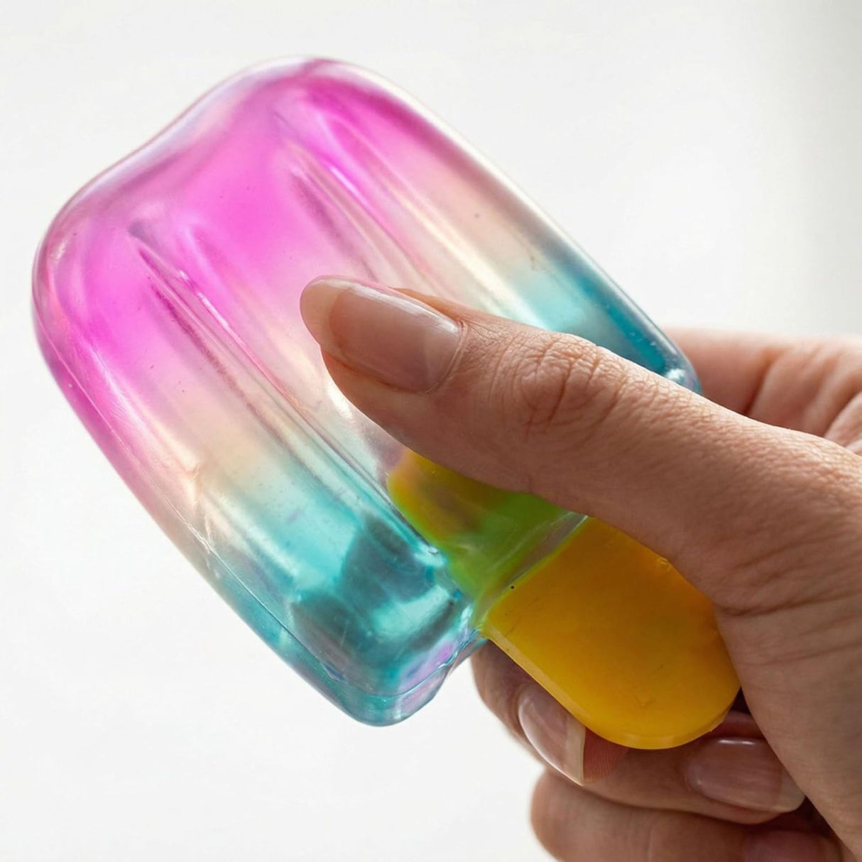 Jucărie senzorială Flippy squishy înghețată, vedere laterală, degradeu ombre roz-galben
